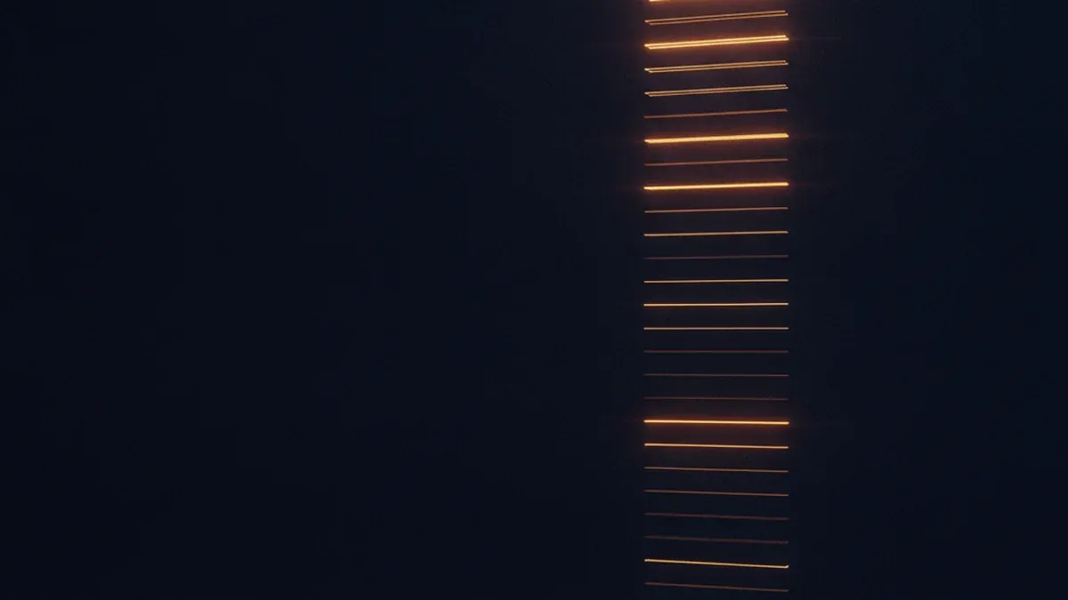 A long descending column of narrow bright strips on a dark background, resembling an endless log with no legible text