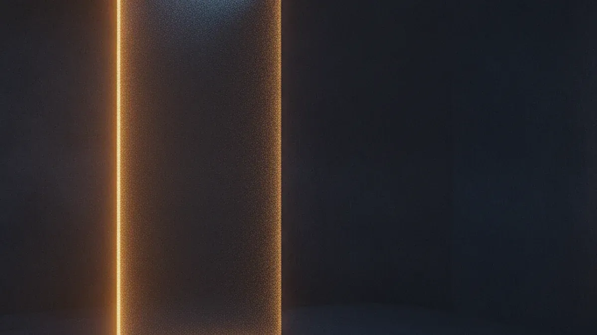 A dark textured wall with a narrow vertical seam running through it, warm light spilling out of the gap into the room